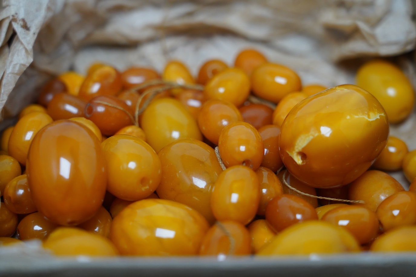 A quantity of assorted loose graduated amber beads, gross weight 146 grams. Condition poor to fair